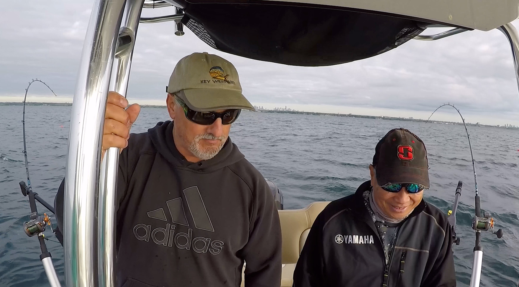 Thumbnail image of Scott Morrow and David Chong on the water, fishing. Click to see David Chong’s testimonial video.