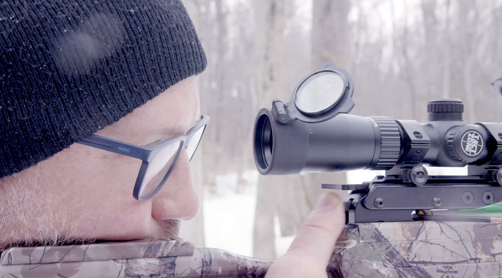 Thumbnail image of client Rob Daciw lining up a shot with his gun. Click to watch his testimonial video.