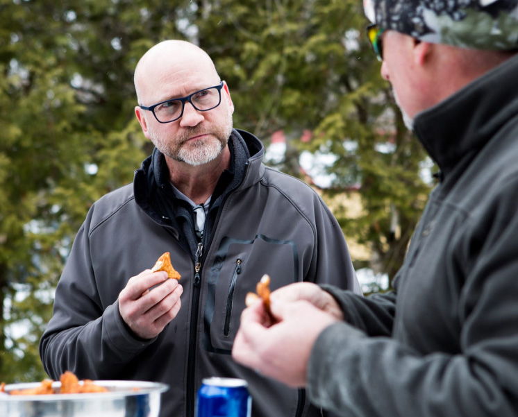 Client Rob Daciw enjoying some food outside with Scott Morrow